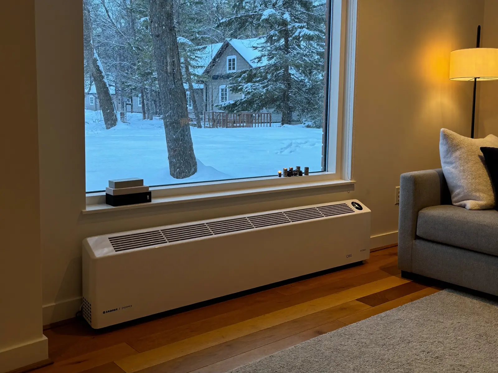 Cozy winter living room with an electric baseboard heater